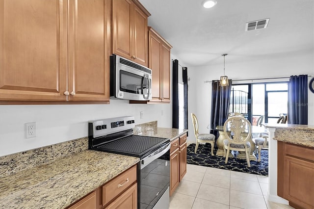 11895 Crestridge Loop, New Port Richey, FL 34655 - kitchen featuring light stone counters, pendant lighting, visible vents, appliances with stainless steel finishes, and brown cabinets