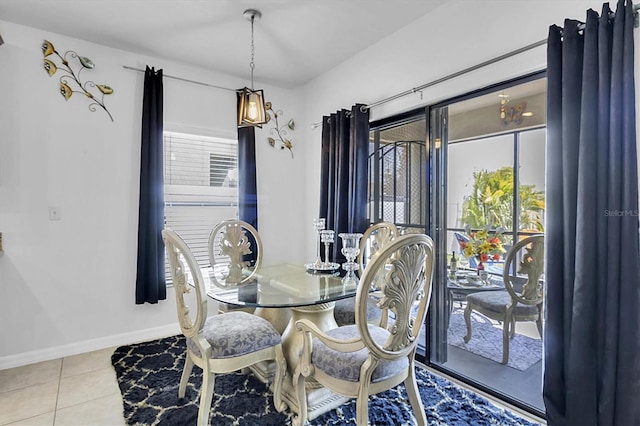 11895 Crestridge Loop, New Port Richey, FL 34655 - dining area with tile patterned floors and baseboards