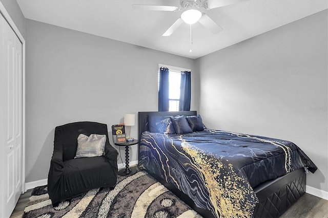 11895 Crestridge Loop, New Port Richey, FL 34655 - bedroom featuring baseboards, wood finished floors, and a ceiling fan