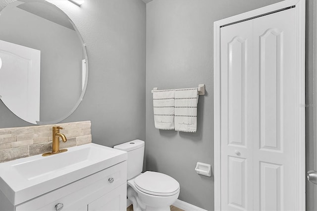 11895 Crestridge Loop, New Port Richey, FL 34655 - bathroom with backsplash, toilet, and vanity