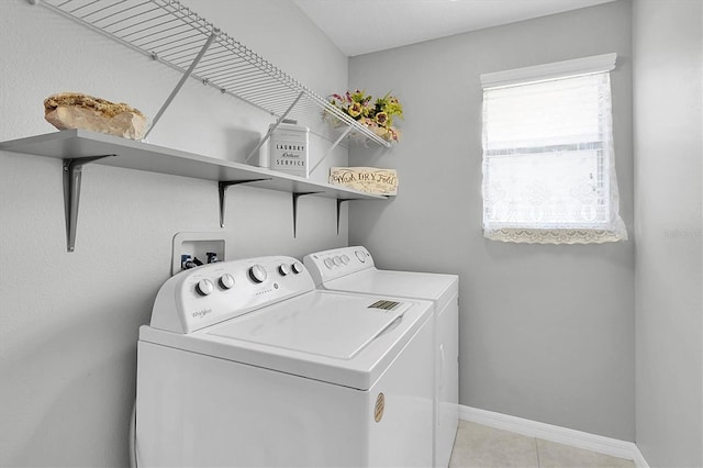 11895 Crestridge Loop, New Port Richey, FL 34655 - laundry room with baseboards, independent washer and dryer, laundry area, and light tile patterned floors