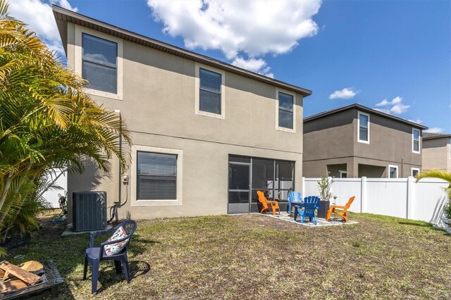 11895 Crestridge Loop, New Port Richey, FL 34655 - back of property featuring stucco siding, central AC unit, fence, and a patio