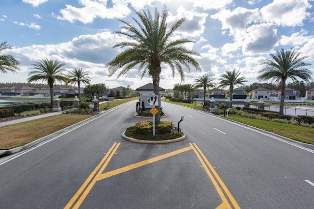 11895 Crestridge Loop, New Port Richey, FL 34655 - view of road with a residential view, traffic signs, and curbs