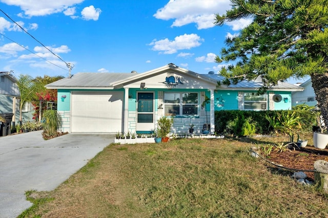 ranch-style home featuring driveway, a front yard, and an attached garage
