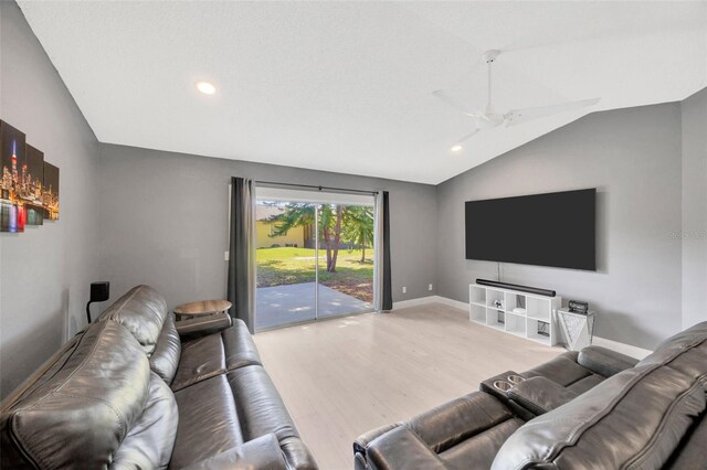 8626 White Springs Dr, New Port Richey, FL 34655 - living room featuring vaulted ceiling, recessed lighting, baseboards, a ceiling fan, and wood finished floors
