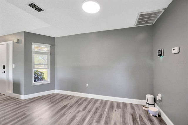 8626 White Springs Dr, New Port Richey, FL 34655 - interior space featuring baseboards, visible vents, and wood finished floors