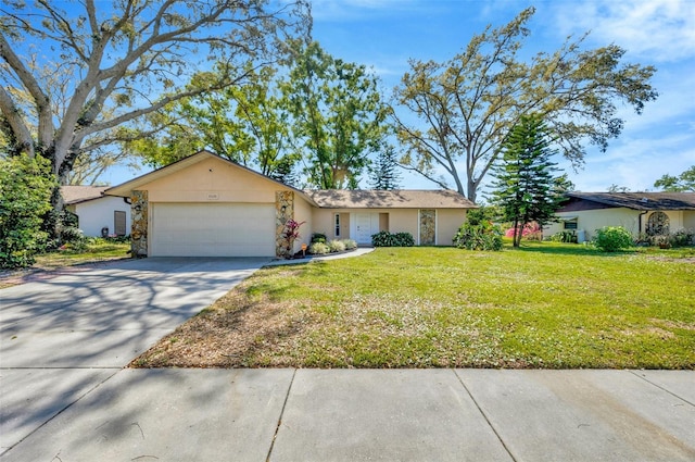 8626 White Springs Dr, New Port Richey, FL 34655 - ranch-style home with driveway, an attached garage, a front lawn, and stucco siding