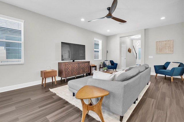 living area featuring baseboards, a ceiling fan, wood finished floors, and recessed lighting