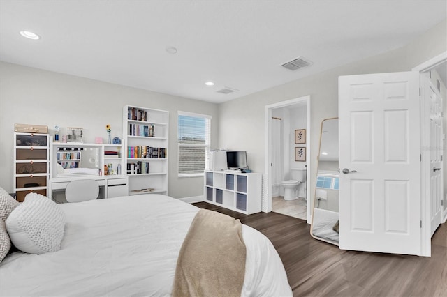 bedroom with visible vents, baseboards, wood finished floors, and recessed lighting