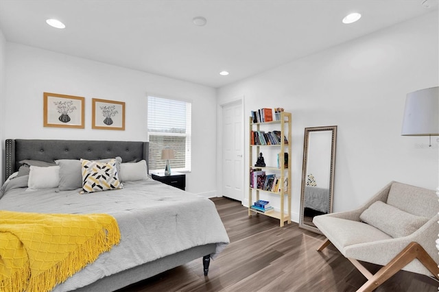 bedroom featuring dark wood-type flooring, baseboards, and recessed lighting