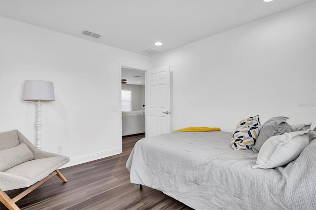 bedroom featuring recessed lighting, wood finished floors, visible vents, and baseboards