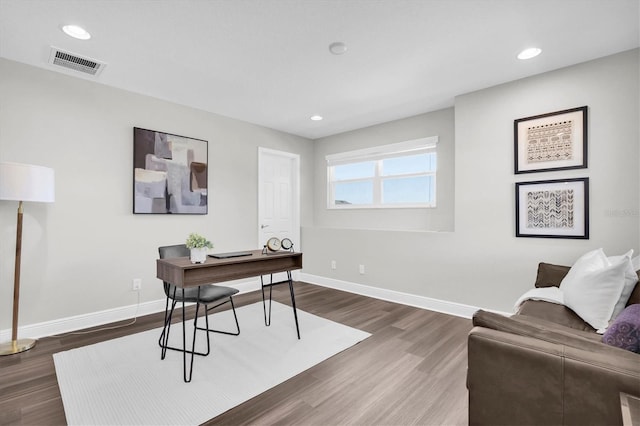 home office featuring baseboards, wood finished floors, visible vents, and recessed lighting