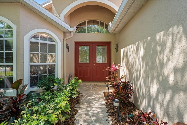 303 Rochester St, Spring Hill, FL 34609 - entrance to property featuring stucco siding