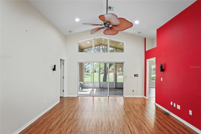 303 Rochester St, Spring Hill, FL 34609 - unfurnished living room featuring wood finished floors, a ceiling fan, visible vents, and baseboards