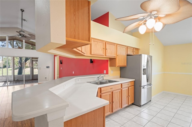303 Rochester St, Spring Hill, FL 34609 - kitchen featuring a peninsula, stainless steel fridge with ice dispenser, a sink, ceiling fan, and light countertops