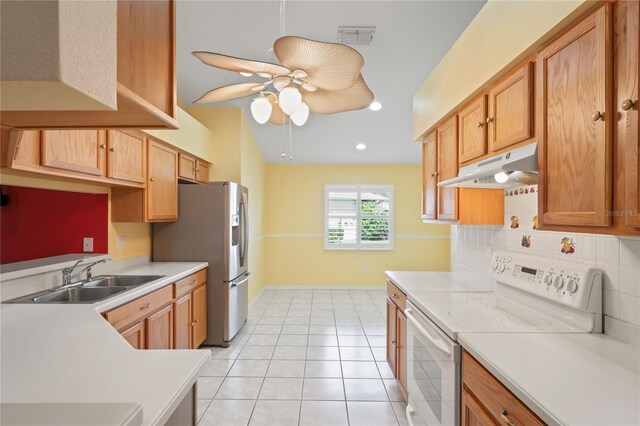 303 Rochester St, Spring Hill, FL 34609 - kitchen with visible vents, ceiling fan, under cabinet range hood, white range with electric stovetop, and a sink