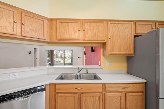 303 Rochester St, Spring Hill, FL 34609 - kitchen featuring light countertops, light brown cabinets, appliances with stainless steel finishes, and a sink