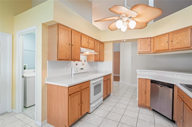 303 Rochester St, Spring Hill, FL 34609 - kitchen with electric range, under cabinet range hood, stainless steel dishwasher, light countertops, and washer / dryer