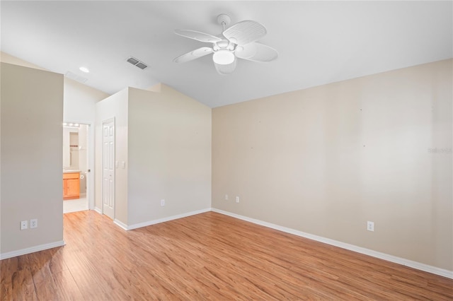 303 Rochester St, Spring Hill, FL 34609 - empty room featuring visible vents, light wood-style flooring, a ceiling fan, baseboards, and vaulted ceiling