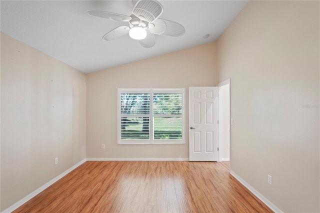 303 Rochester St, Spring Hill, FL 34609 - unfurnished room with light wood-type flooring, baseboards, ceiling fan, and vaulted ceiling