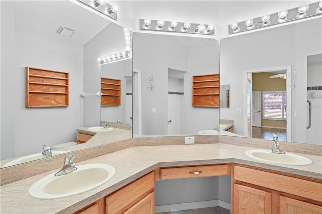 303 Rochester St, Spring Hill, FL 34609 - full bath with visible vents, two vanities, and a sink