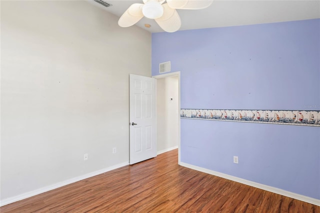 303 Rochester St, Spring Hill, FL 34609 - empty room featuring a ceiling fan, wood finished floors, visible vents, baseboards, and lofted ceiling