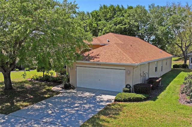 303 Rochester St, Spring Hill, FL 34609 - view of front of home featuring driveway, a shingled roof, stucco siding, a front lawn, and a garage