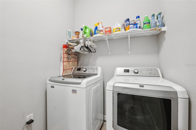 clothes washing area featuring laundry area and independent washer and dryer