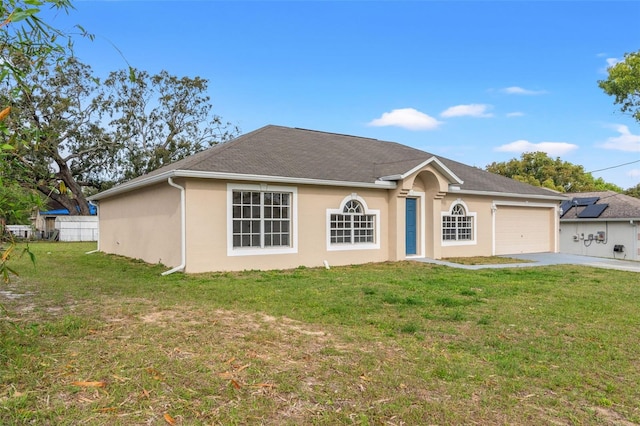 single story home featuring driveway, a garage, and stucco siding