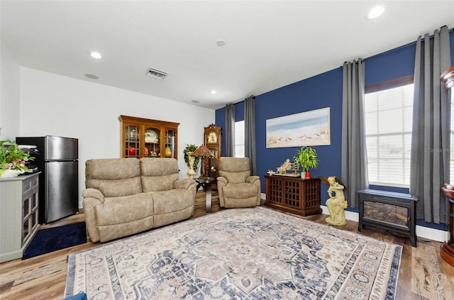10623 Marsha Dr, New Port Richey, FL 34655 - living room with wood finished floors and recessed lighting