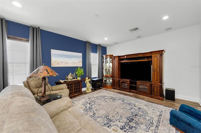 10623 Marsha Dr, New Port Richey, FL 34655 - living room featuring wood finished floors, baseboards, and recessed lighting