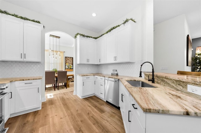 10623 Marsha Dr, New Port Richey, FL 34655 - kitchen featuring a sink, dishwasher, light wood-style floors, white cabinetry, and recessed lighting