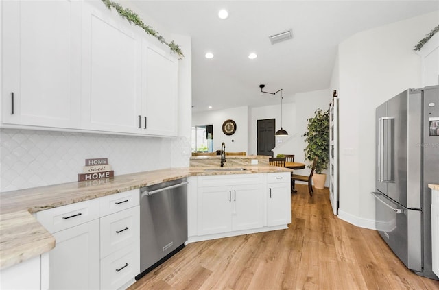 10623 Marsha Dr, New Port Richey, FL 34655 - kitchen with stainless steel appliances, a sink, light wood-style flooring, backsplash, and recessed lighting