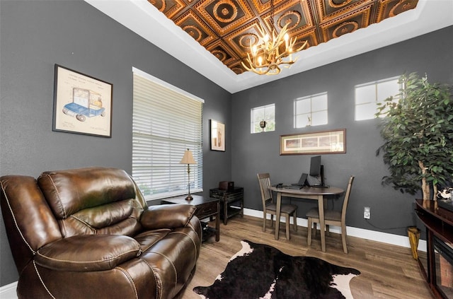 10623 Marsha Dr, New Port Richey, FL 34655 - living area featuring an ornate ceiling, a desk, wood finished floors, a tray ceiling, and a chandelier