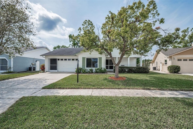 ranch-style house with an attached garage, a front lawn, and concrete driveway