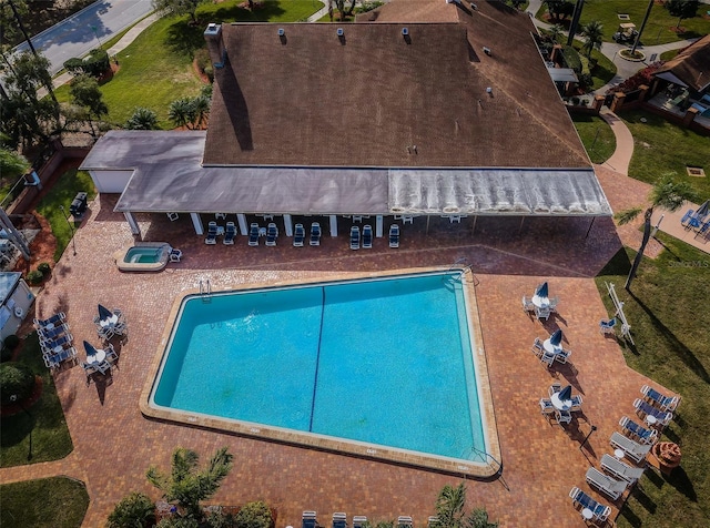 community pool featuring a patio area