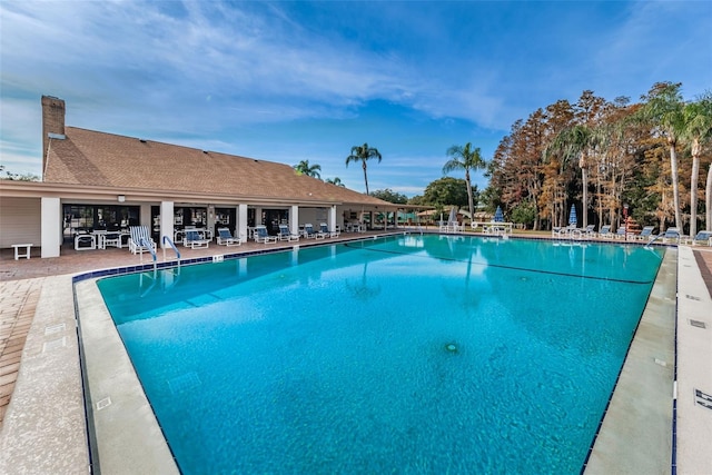 community pool featuring a patio area