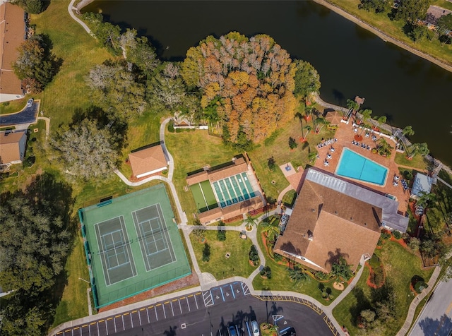 birds eye view of property with a water view