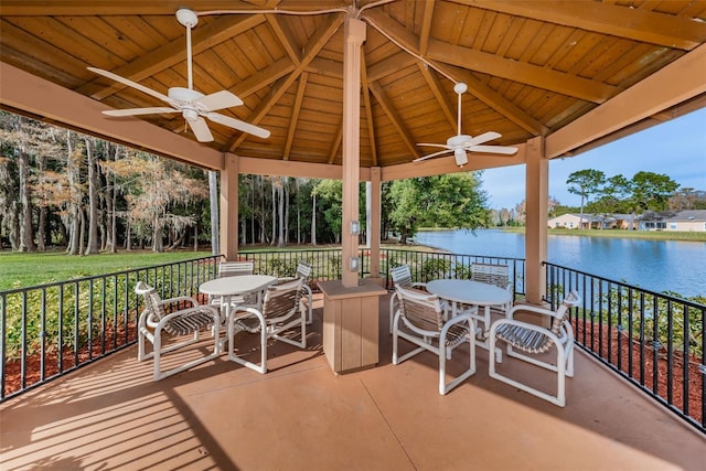 view of patio / terrace featuring a water view, ceiling fan, and a gazebo