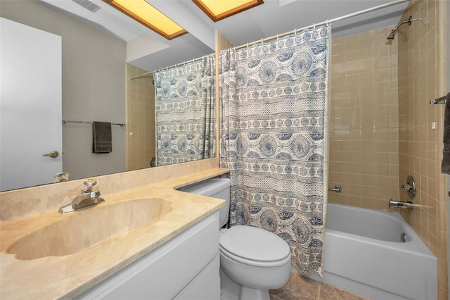 bathroom featuring vanity, shower / bath combo with shower curtain, toilet, and visible vents