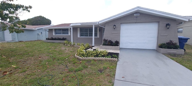 ranch-style home with an attached garage, a front lawn, and driveway