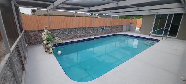 view of swimming pool featuring a fenced in pool, a patio area, and a fenced backyard