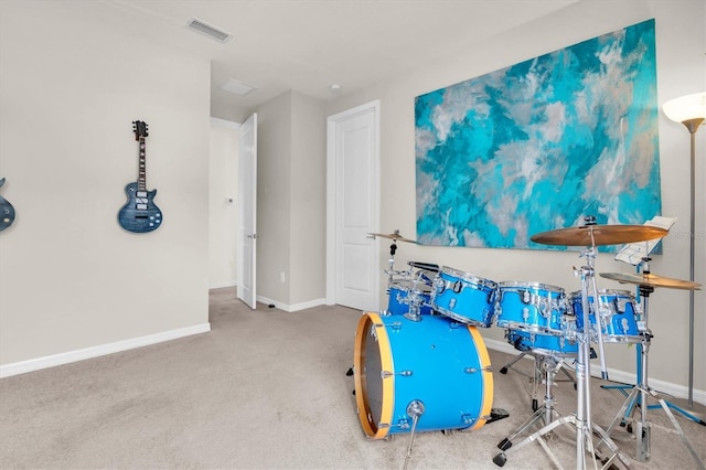 recreation room featuring carpet floors, baseboards, and visible vents