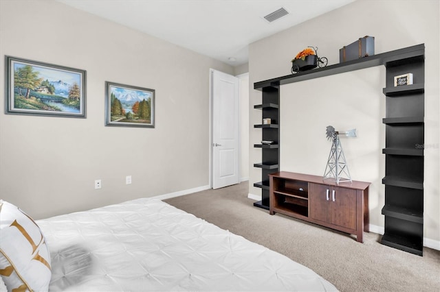 carpeted bedroom with baseboards and visible vents