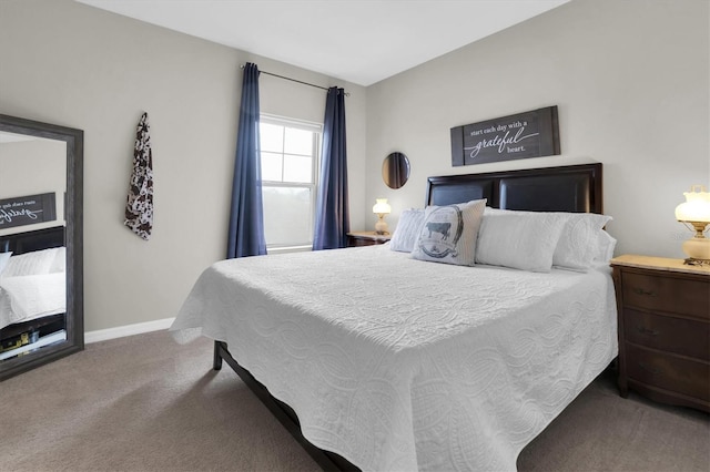 bedroom featuring baseboards and carpet flooring