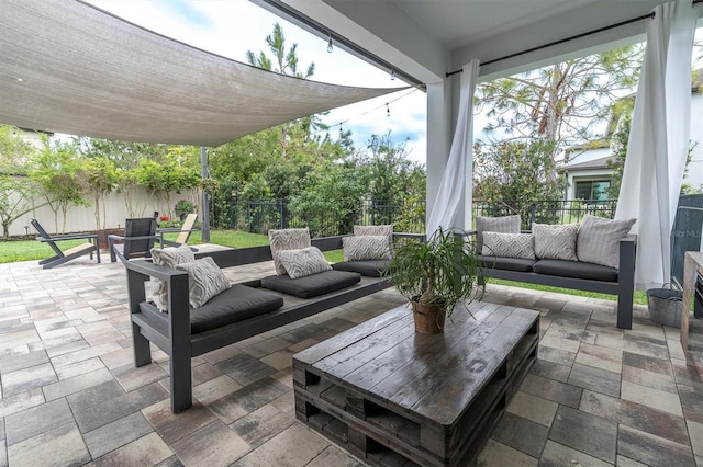 view of patio / terrace featuring a fenced backyard and an outdoor hangout area