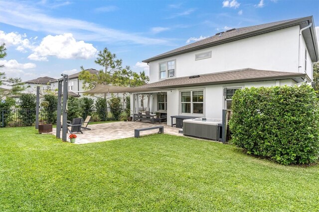 back of property with a patio area, central air condition unit, stucco siding, fence, and a yard