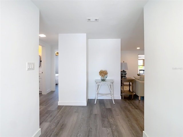 4936 Dory Dr, New Port Richey, FL 34652 - hall with baseboards, visible vents, and wood finished floors