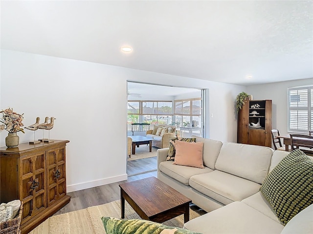 4936 Dory Dr, New Port Richey, FL 34652 - living area featuring baseboards, wood finished floors, and recessed lighting