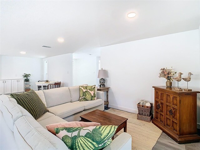 4936 Dory Dr, New Port Richey, FL 34652 - living room featuring baseboards, recessed lighting, visible vents, and light wood-style floors